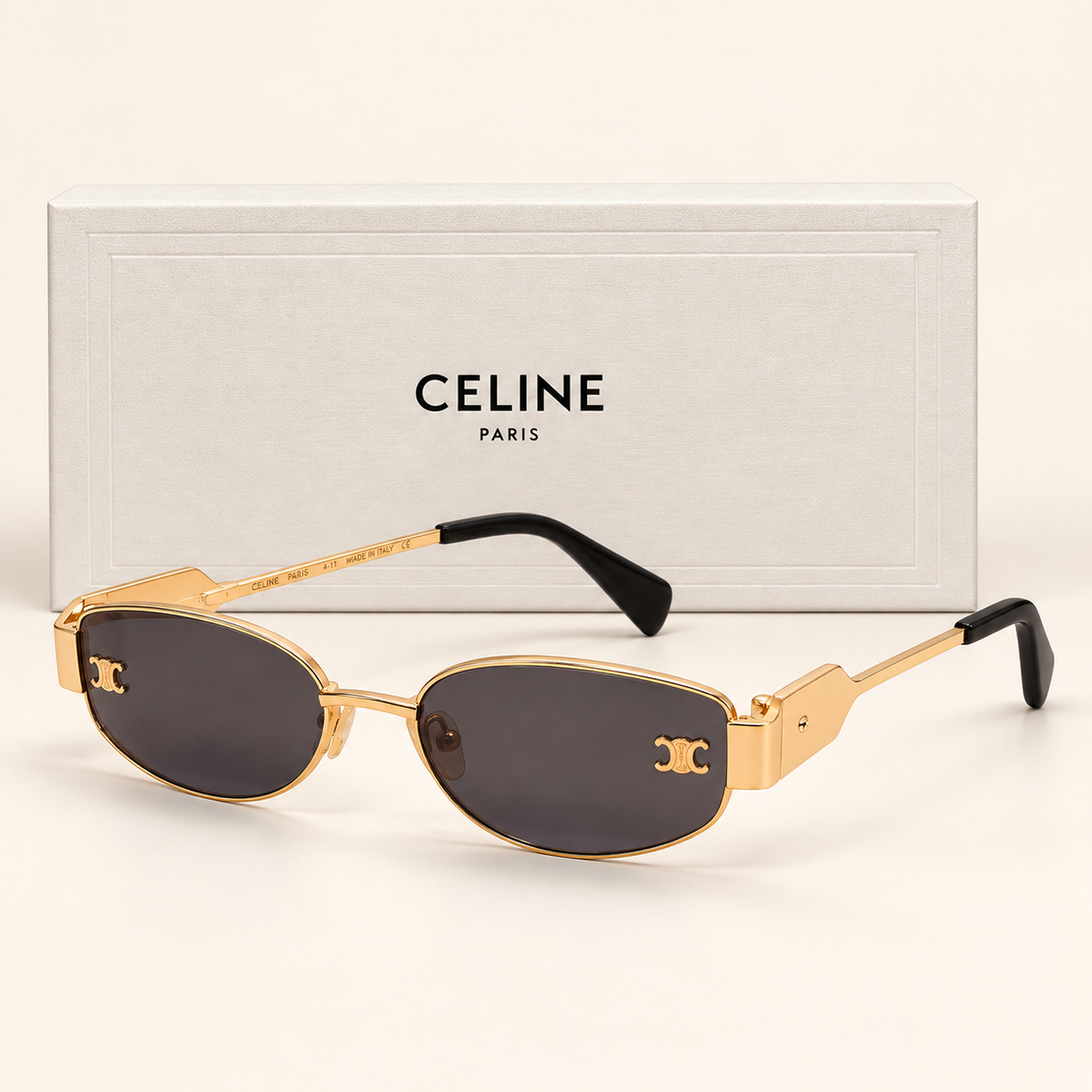 CLN — Gold Smoke Oval Sunglasses – Model 2 — front-left view with brand box